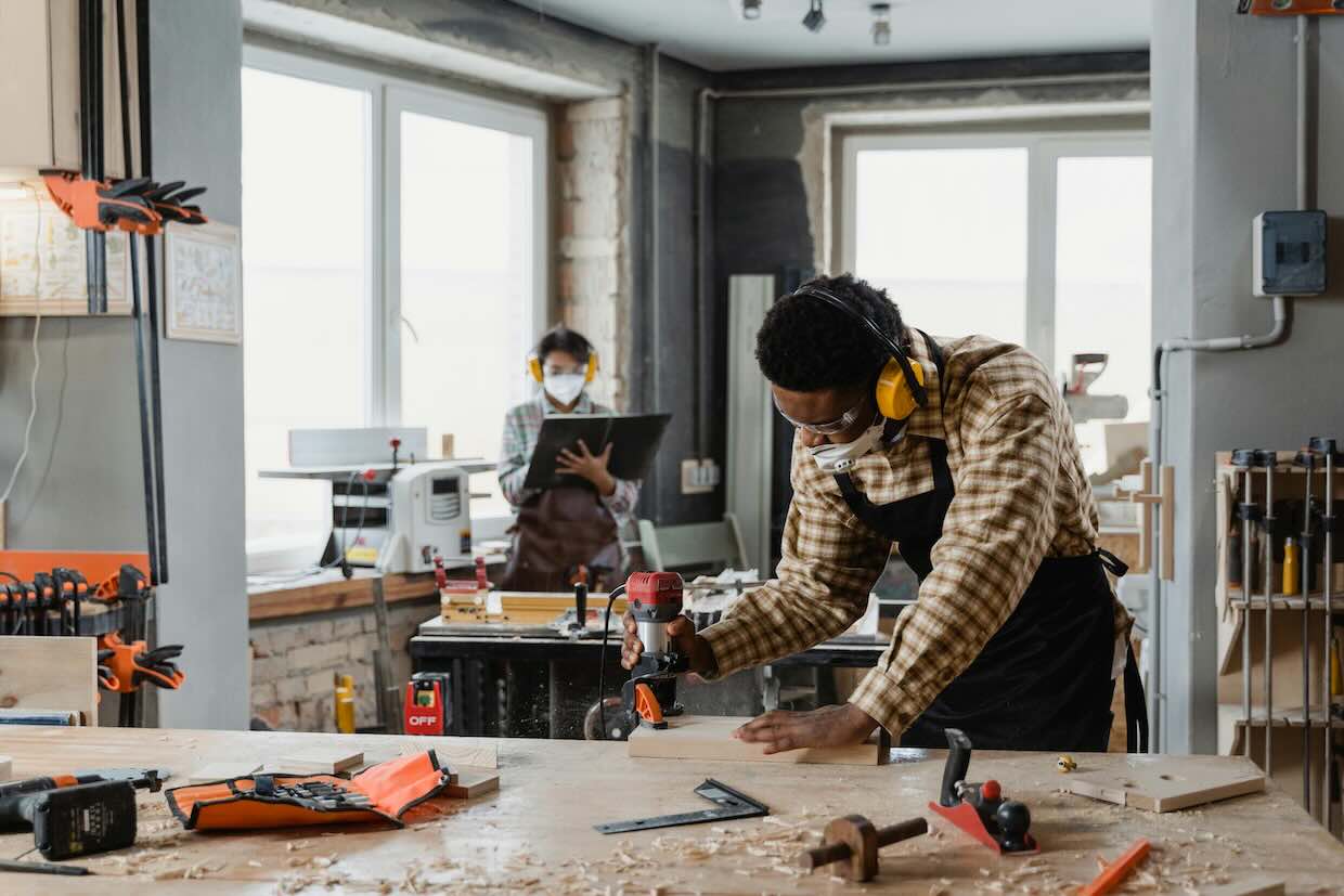 skilled tradespeople at work in carpentry environment